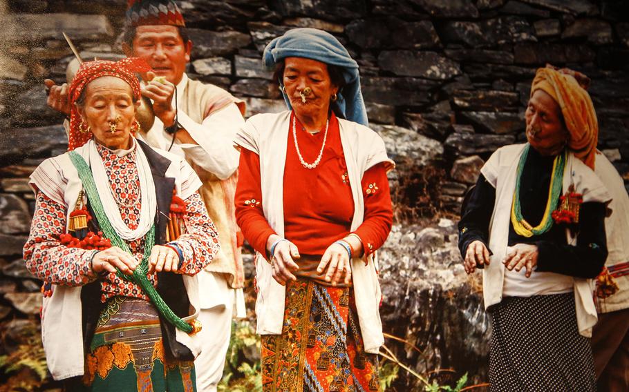 In a photo at the exhibit, three women of the Rai ethnic minority are shown prepared for a festival. They were designated matriarchs for the event and were thus alllowed into the inner walls of the festival site.