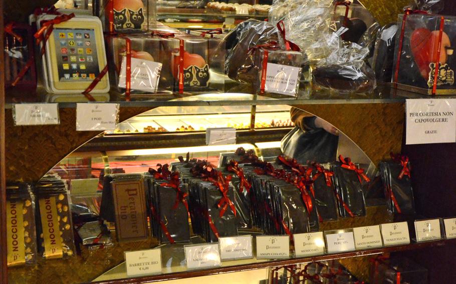 Elaborate chocolate creations fill the shelves of Peratoner, a chocolate shop in Pordenone, Italy.