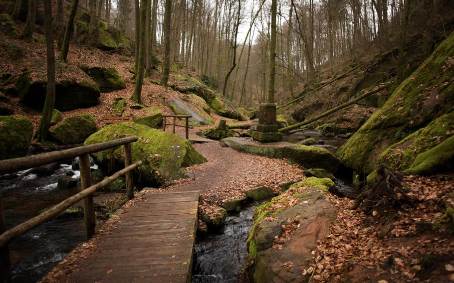 Numerous wooden foot bridges crisscross the Moosalbe stream as it zigzags down the Karlstalschlucht, near Trippstadt, Germany.