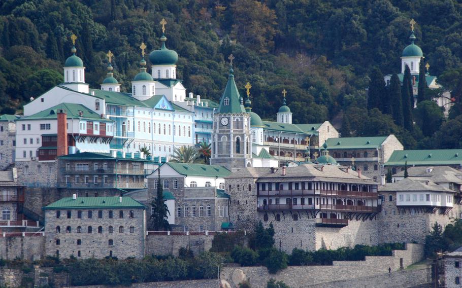 One of the monasteries on Mount Athos, Greece, as seen from a boat on the Aegean Sea. Only men can go ashore on Mount Athos, so this photographer had to use her telephoto lens to get a better look.