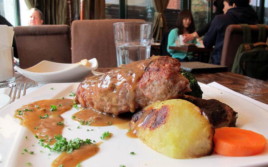 The Boliarsko kiufte, a long pork and beef meatball stuffed with ham, cheese and pickles, is among the rotating specials at Bulgarian restaurant Zelen.