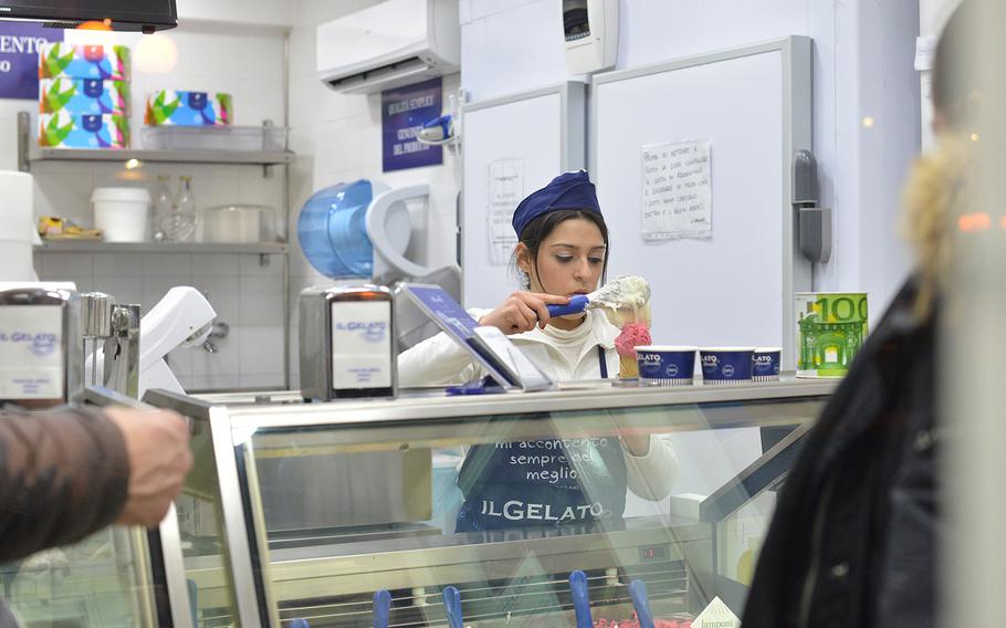 Chiara Vitiello serves a cone at Il Gelato Vitiello, a gelato shop in Vomero's Piazza Vanvitelli.