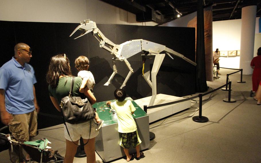 Robo-dinosaur, where Jurassic meets joy-stick. Visitors can manipulate a robotic dinosaur at the exhibit. 