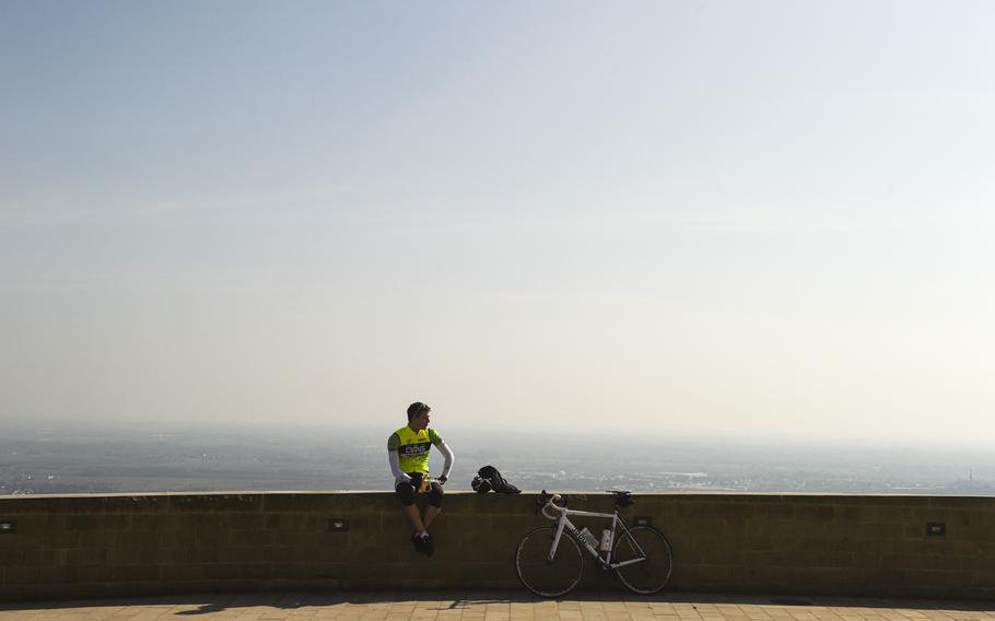 A cyclist rests outside the Hambach Castle after riding up nearly 1,200 feet. There are many hiking trails leading up to the castle, known as "the cradle of German democracy." 