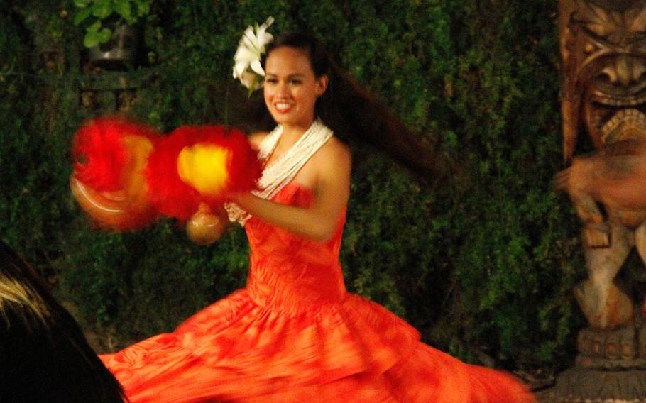 A Hawaiian dancer swirls for the dinner crowd during a recent weekday evening at Makittii.

Wyatt Olson
Stars and Stripes