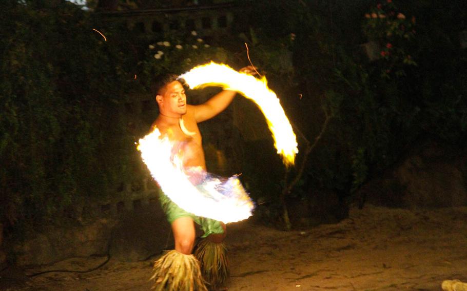 A fire dancer swirls his flaming baton amid the evening darkness.

Wyatt Olson
Stars and Stripes