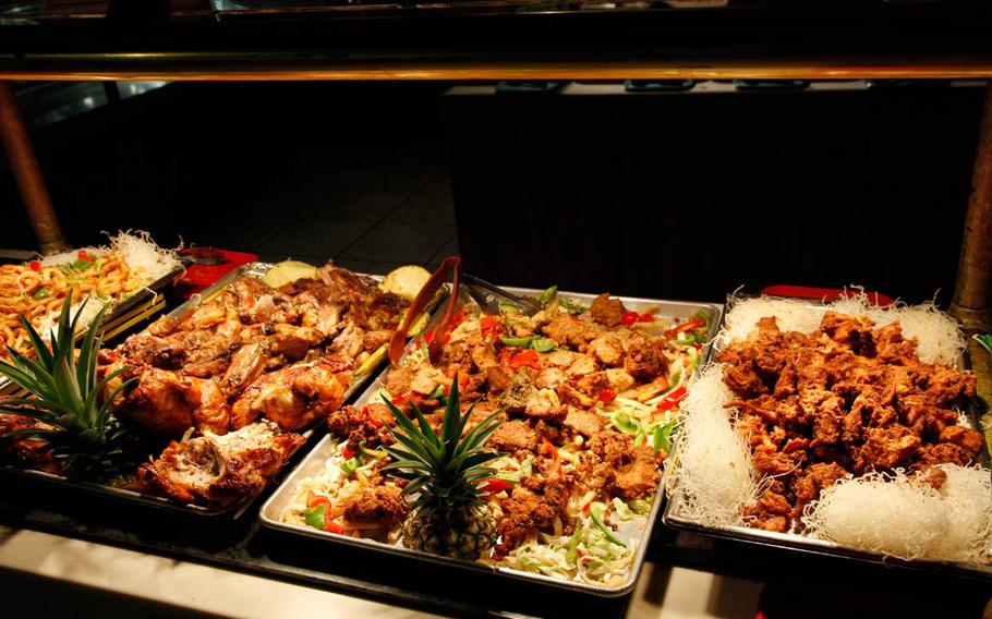 Deep-fried chicken and seafood fill several serving counters at the buffet.

Wyatt Olson
Stars and Stripes