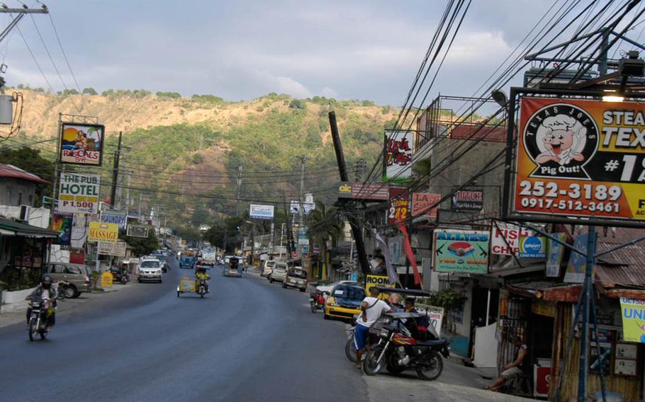 There are plenty of bars and nightclubs along the main street in Bario Baretto. Seth Robson/Stars and Stripes