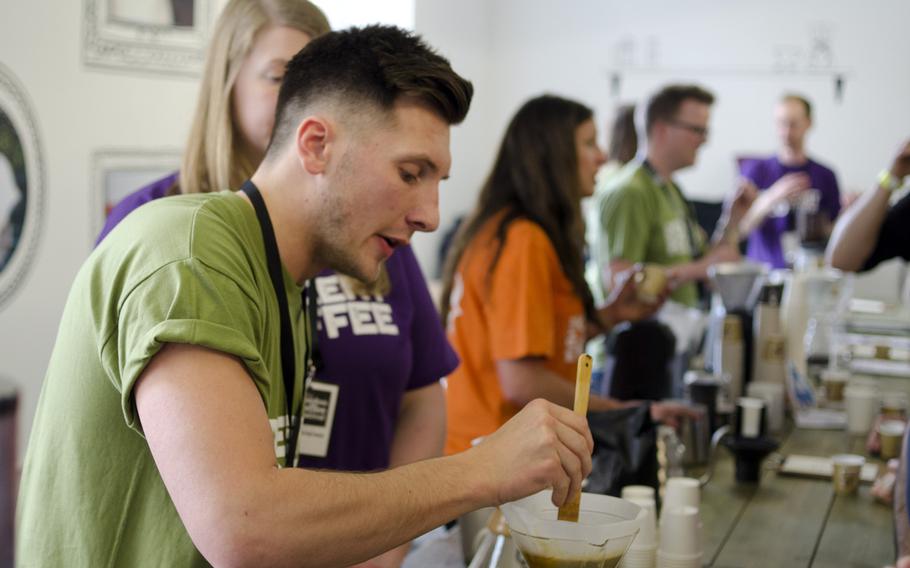 James Bellis with Make Decent Coffee shows visitors how to use the pour-over coffee method at the 2014 London Coffee Festival on Saturday, April 5, 2014.