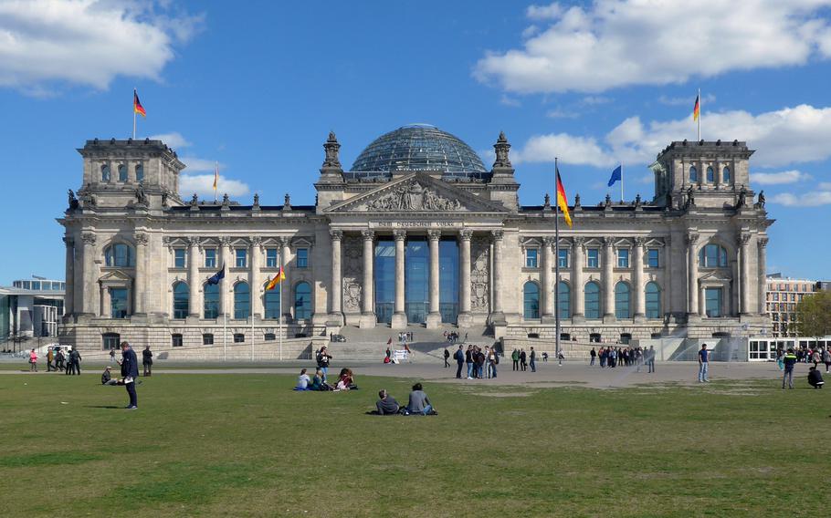 The Reichstag in Berlin is the seat of the German parliament. It opened in 1894, was heavily damaged by a fire in 1933 and during the battle for Berlin in 1945. It was rebuilt in 1973 and used as an exhibition hall. After the reunification of Germany, and being wrapped in cloth by the artists Christo and Jeanne-Claude, it was completely renovated and opened for parliament in 1999 with the cupola designed by Norman Foster.