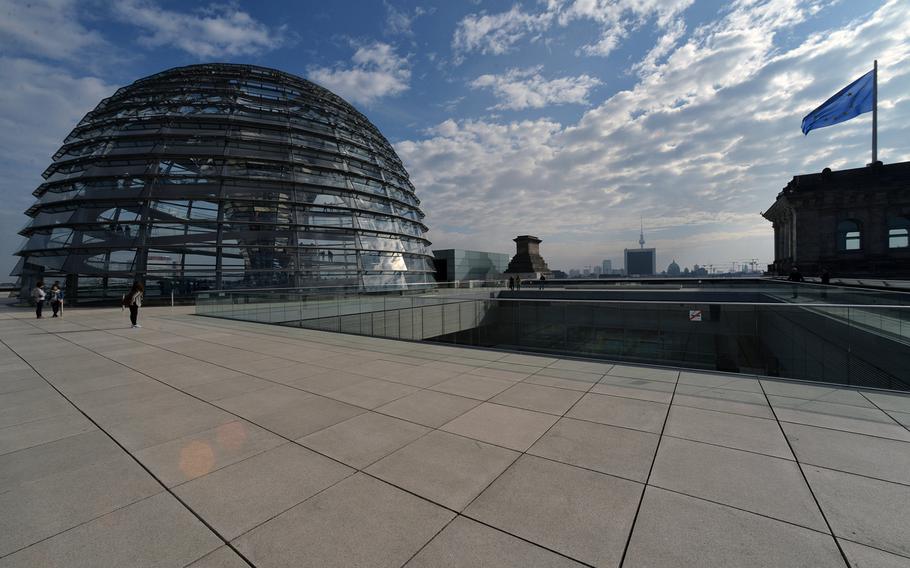 The roof of the Reichstag with its cupola is a favorite tourist destination in Berlin.