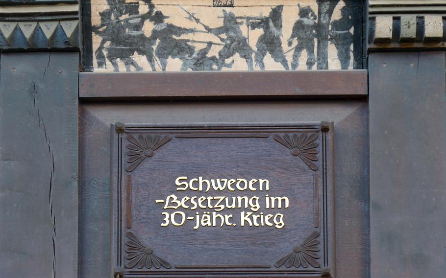 A series of paintings over the ground floor of Haus Schmieding on Minden's market square depict scenes from the town's history, here the occupation by the Swedes in the Thirty Years War. Others are of a royal wedding, the Reformation and the opening of the railway between Cologne and Minden.