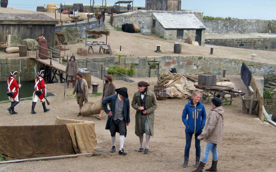At a "Poldark" filming location in Charleston, Cornwall, England, when the director yells "Cut!" after just a few minutes of filming, some of the extras laugh, as if the whole enterprise is just a lark.
