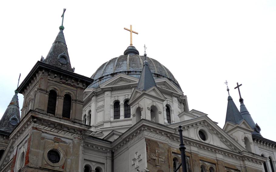 Many crosses to the steeples and dome of the Church of the Holy Trinity on Piotrkowska Street in Lodz, Poland. The church was built in the mid-1820s and is at the beginning of Piotrkowska Street, Lodz's central pedestrian avenue. 