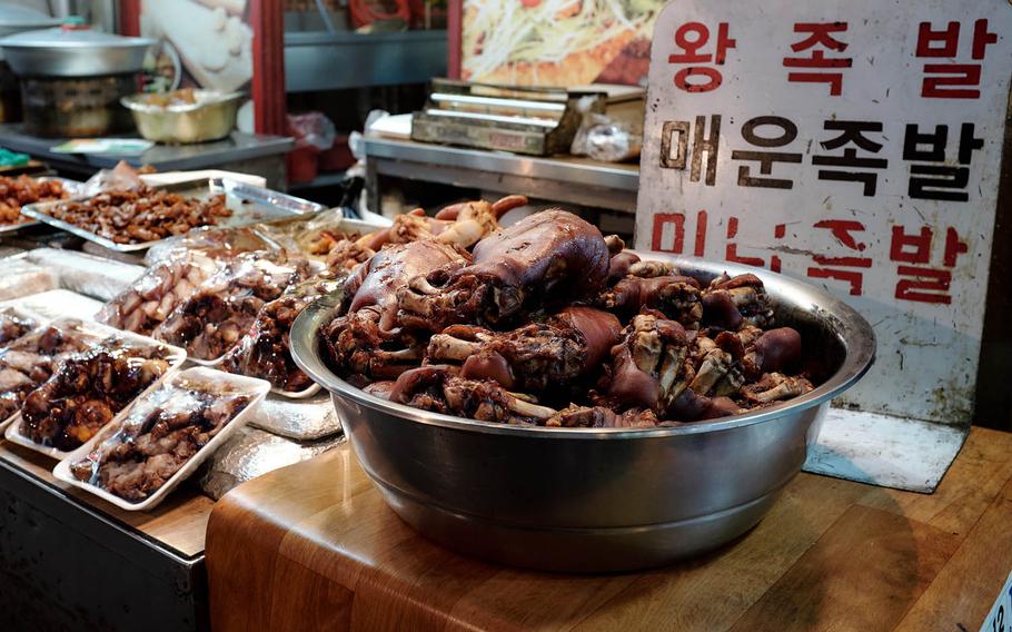 Among the more adventurous food options at Tong Bak Market in Pyeongtaek, South Korea, comes from bowls filled with pig's feet, ears, tails and snouts. These parts are commonly braised and boiled to make a dish called jokbol and eaten with an alcoholic beverage like soju.