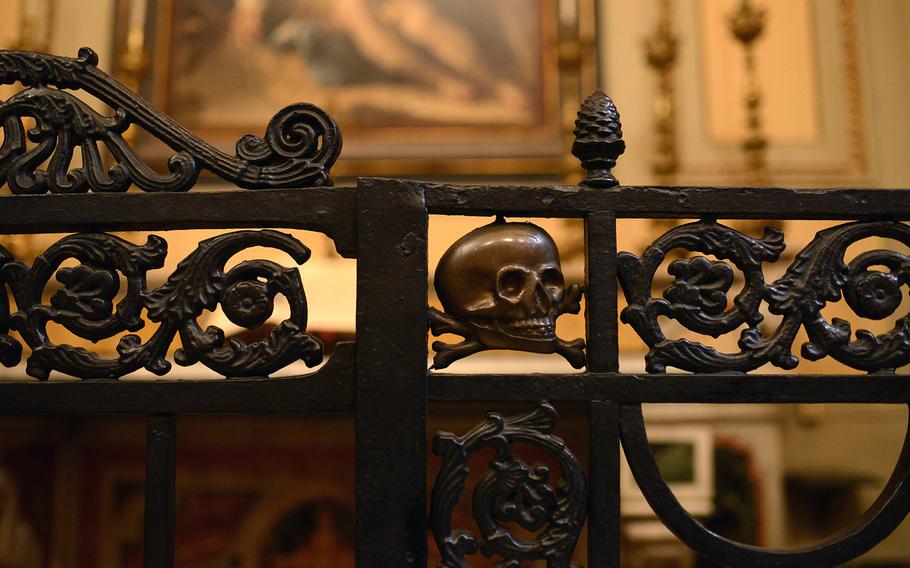 Skull-and-crossbones emblems are common inside the church of Saint Mary of the Purgatory Souls at the Arch (Santa Maria delle Anime del Purgatorio ad Arco) on Via dei Tribunali in downtown Naples, Italy. A lower floor in the building houses human skulls to which some believers pray for protection and favors.
