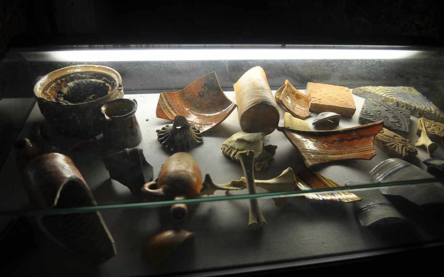 Some artifacts uncovered when the cellar labyrinth in Oppenheim, Germany, was restored are on display underground.