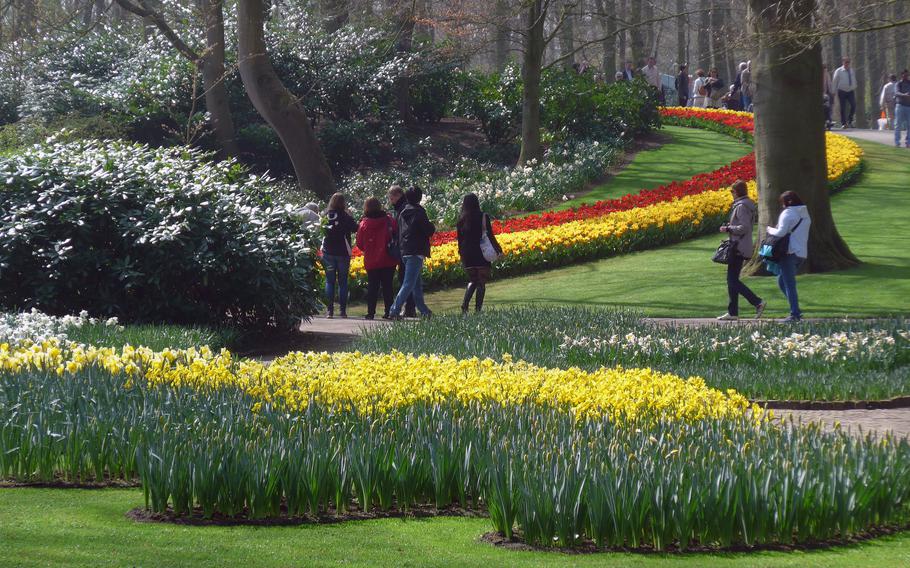 Visitors to Keukenhof walk past rows of tulips, April 10, 2015.  