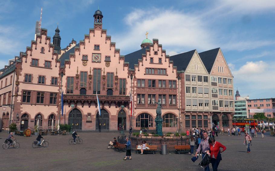 You only get a glimpse of the Roemer, Frankfurt, Germany's town hall, from the tour bus, but a stop on the route is nearby. One of the buses can be seen in the background at right.