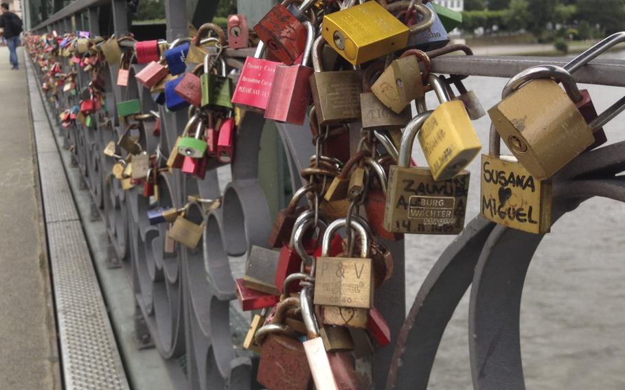 Frankfurt, Germany's Eiserner Steg is a pedestrian bridge over the Main River, constructed in 1868. In recent years couples have taken to proving their love by writing or etching their names onto locks, attaching them to the bridge and throwing the key into the river. Eiserner Steg one of the stops on the Frankfurt on Foot guided tour, which covers much of the city center over three and a half hours.