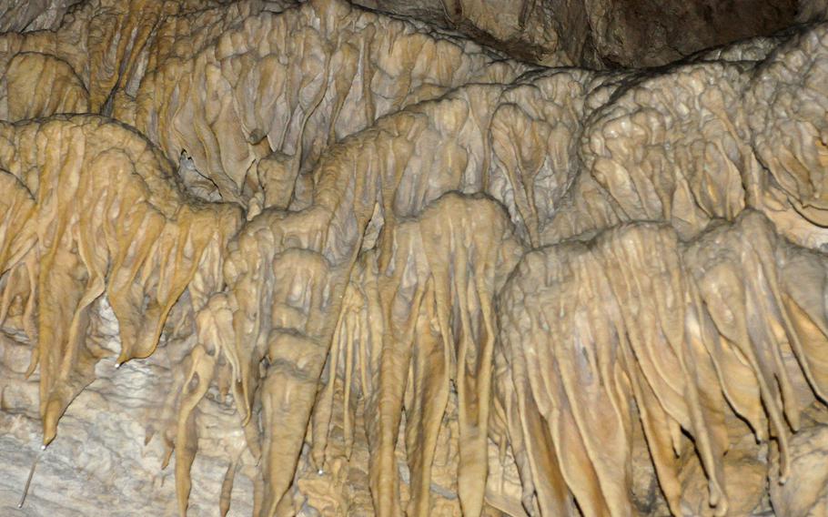 Stalactites and stalagmites aren't the only rock formations inside Grotta Nuova di Villanova. When water slowly drips along the walls other formations are created.