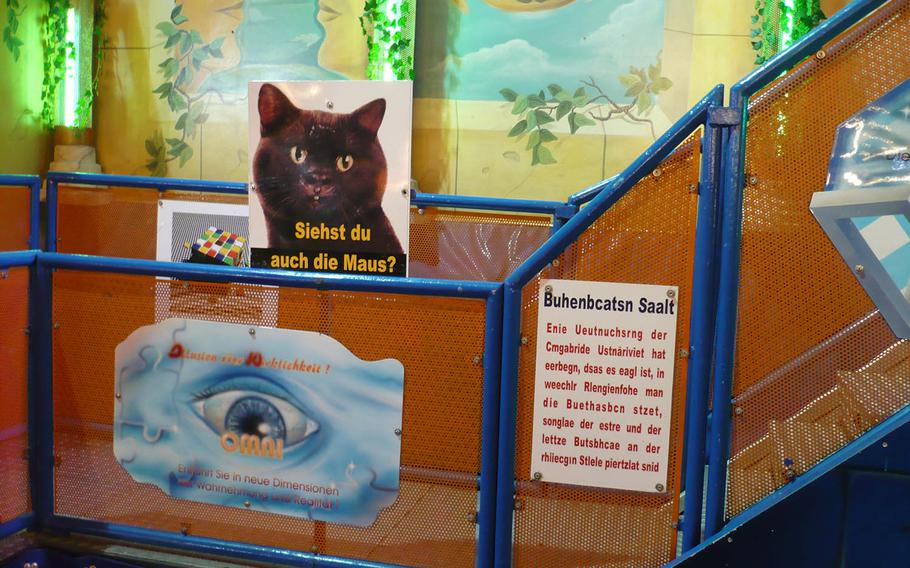 This attraction at the 2016 Hamburger DOM.peddles the art of illusion and beckons passerby to observe the image within the cat's face. Photo by Karen Bradbury/Stars and Stripes