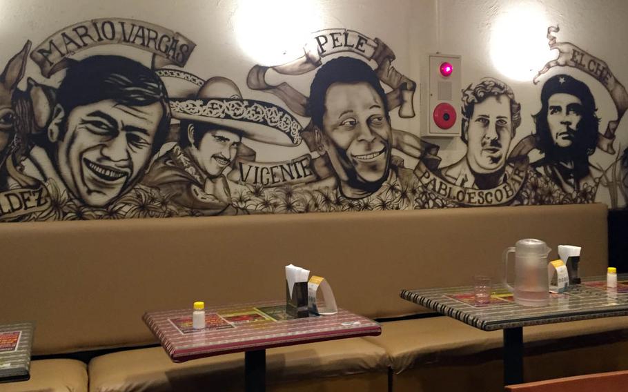 A mural featuring people such as Che Guevara and Pablo Escobar covers the walls at Geodana, a Latin-American restaurant near Yokosuka Naval Base, Japan.