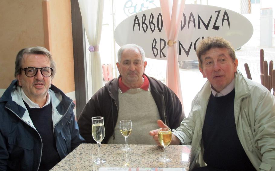 Abbondanza Brunch in Vicenza, Italy, is the coffee bar of choice for local students, workers and pensioners, pictured here socializing over a drop of vino bianco.