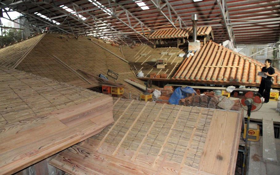 Tsukayama brewer Hidekazu Akimura stares out at the distillery's exposed roof during construction in April. The distillery is wrapping up a five-year, $3.5 million renovation.