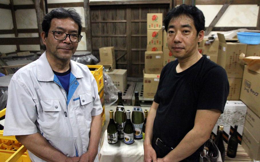 Tsukayama Distillery has only two brewers who follow its product the entire way from start to finish: Koyu Koki, chief brewer, left, who has 20 years of experience brewing Okinawa's signature alcoholic beverage, and Hidekazu Akimura, from Chiba, a brewer for 10 years.