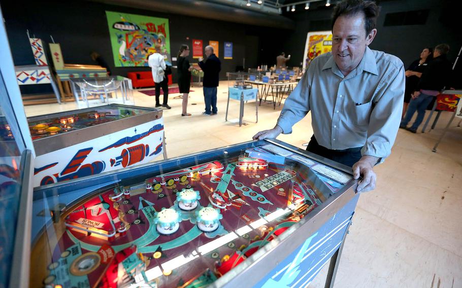 Pacific Pinball Museum Executive Director Michael Schiess demonstrates one of the museum's pinball machines that is part of "The Art and Science of Pinball" exhibit at the Chabot Space & Science Center during an advanced preview for the news media in Oakland, Calif. 
