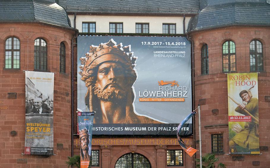 The huge poster adorning the facade of the Historical Museum of the Palatinate in Speyer, Germany, announcing the exhibit ''Richard Lionheart King – Knight – Prisoner.'' An exhibit about Robin Hood opens in November at the museum.