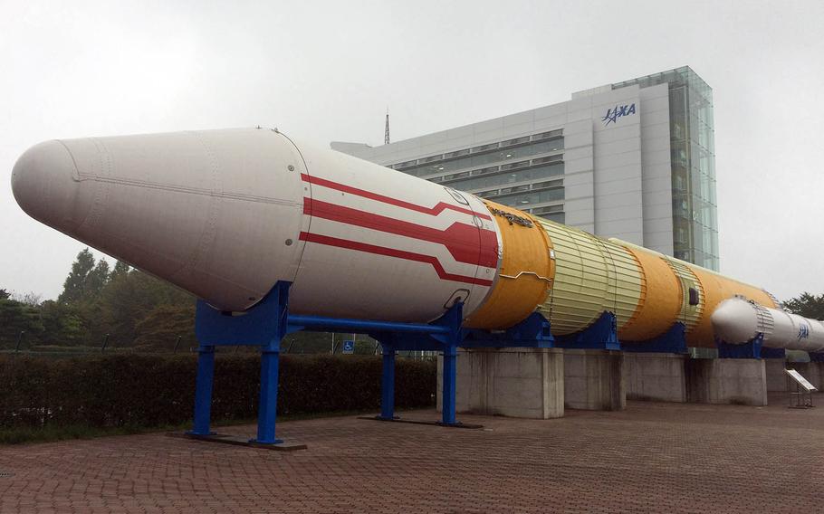 A 50-meter-long, 250-ton H-II launch vehicle stands in Rocket Plaza near the main gate of the Tsukuba Space Center in Ibaraki Prefecture, Japan.