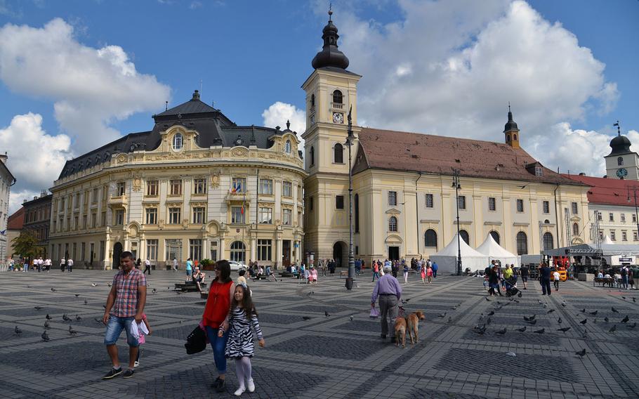 Sibiu's Piata Mare or Great Square, is the heart of the Romanian city. At center is the 18th-century baroque Catholic church.