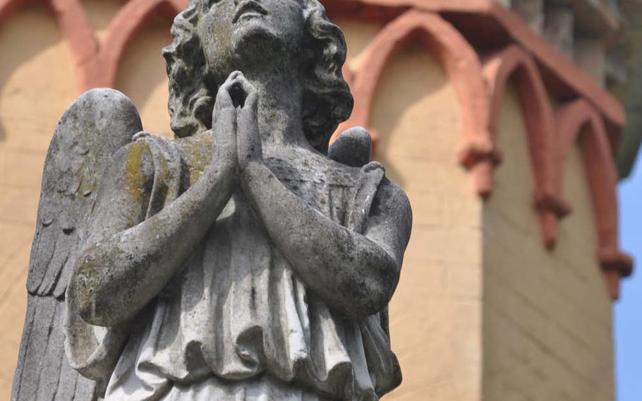 An angel statue offers a prayer atop the chapel at Parco di Villa Vardi near Brugnera, Italy.