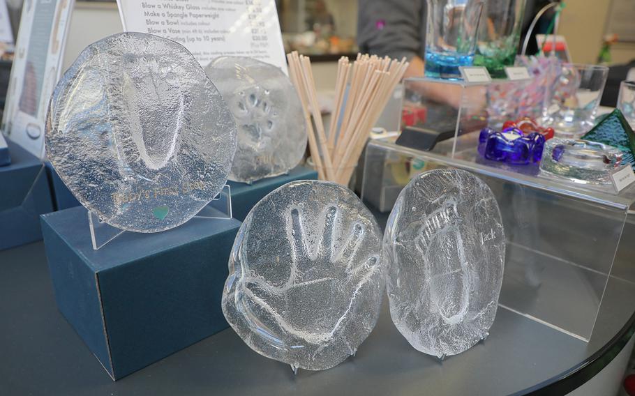 Children's hand and footprints cast in glass are one of the unique gifts available at Langham Glass in Fakenham, England. The glass makers make a mold of the hands or feet of customers' children and cast them in glass.