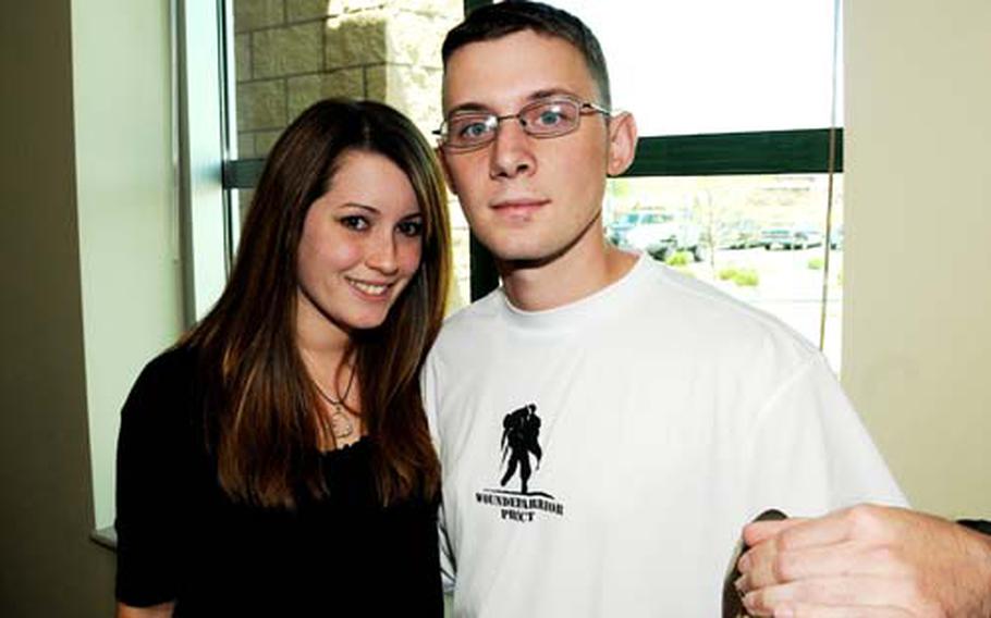 1st Lt. Jason Mazzella, right, a field artillery officer who was injured in Afghanistan, poses with his wife Brianna, who is his non-medical attendant. Mazzella has been in the Warrior Transition program for three months and has had seven surgeries due to an improvised explosive device attack on his deployment.