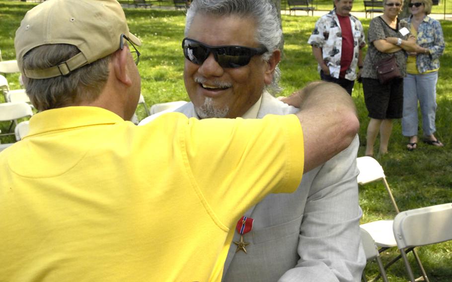 Antonio Martinez is congratulated after being awarded the Bronze Star.