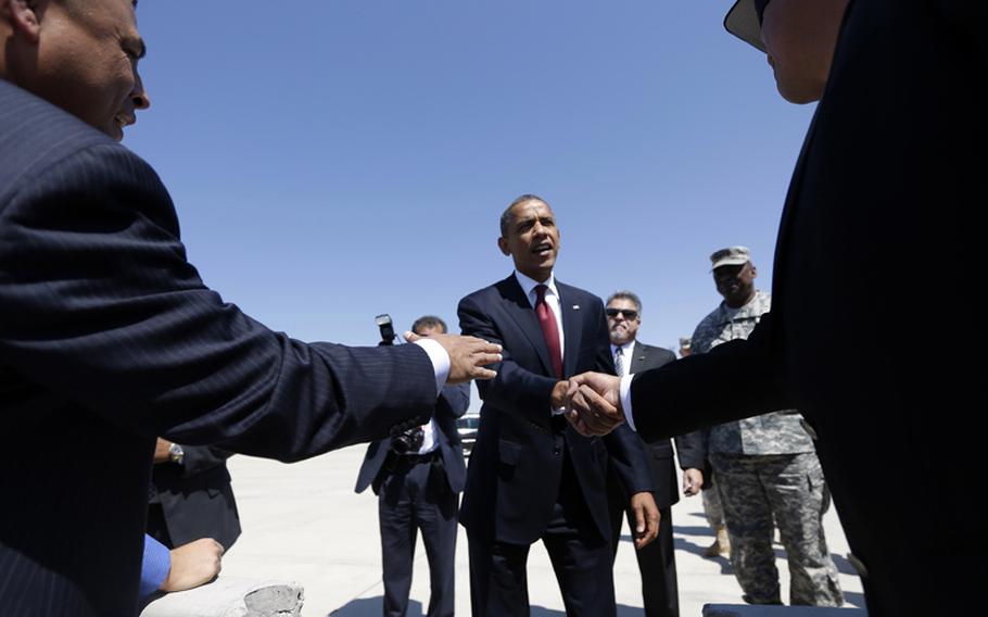 President Barack Obama greets members of the military and their families upon his arrival at Biggs Airfield at Fort Bliss, Texas, Friday, Aug. 31, 2012.