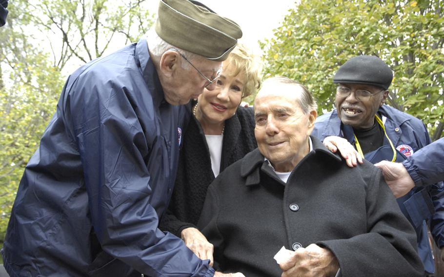 Former Senator Bob Dole visits with veterans at the World War II Memorial in Washington, D.C., on Saturday.