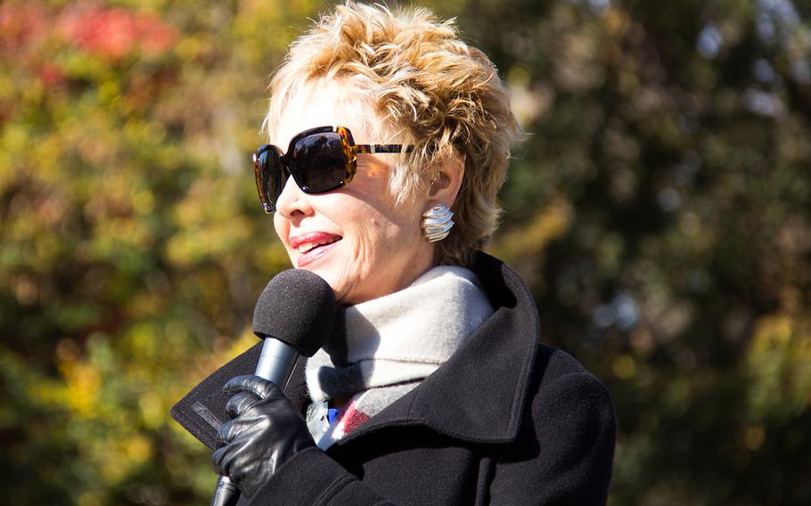 Jan Daley, Bob Hope Tour Vietnam USO Entertainer, on a microphone check a the Annual Veterans Day Observance at the Wall event on November 11, 2013 in Washington, D.C.