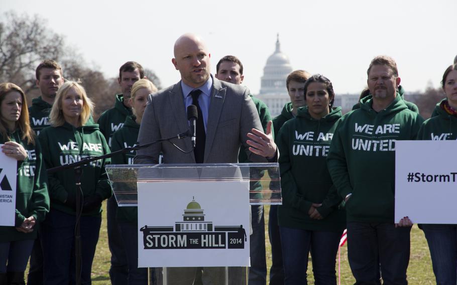 Paul Rieckhoff, director of Iraq and Afghanistan Veterans of America (IAVA), calls for the passage of a new bill aimed at stopping veteran suicides on the National Mall in Washington, D.C., on March. 27, 2014. IAVA planted 1,892 flags on the National Mall, each representing the number of veterans and servicemembers estimated to have committed suicide so far in 2014.