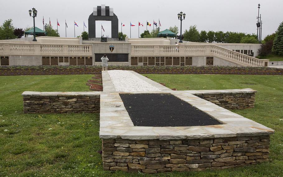A monument in the shape of the shoulder patch of the Supreme Headquarters, Allied Expeditionary Force, in the Reynolds Garden at the National D-Day Memorial in Bedford, Va.