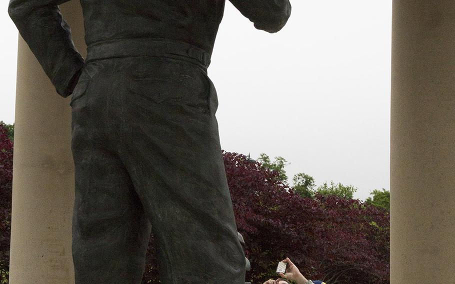 A visitors photographs "The Supreme Commander," a statue of Gen. Dwight D. Eisenhower at the National D-Day Memorial in Bedford, Va.