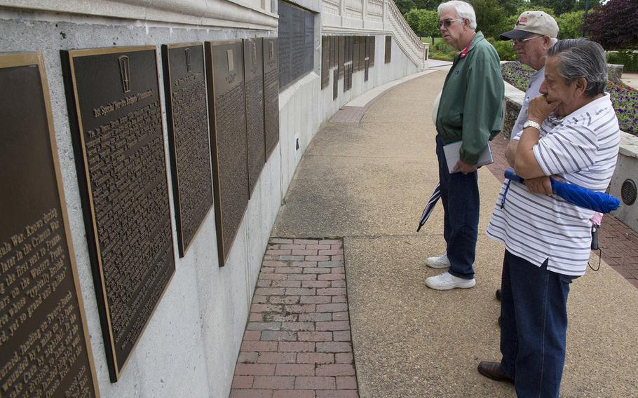 Visitors to the National D-Day Memorial in Bedford, Va., read some of the numerous commemorative plaques.