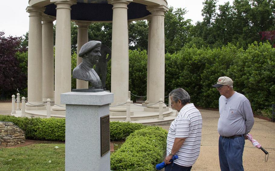 Visitors at the National D-Day Memorial at Bedford, Va., read the plaque beneath a bust of British Field Marshal Bernard Montgomery.