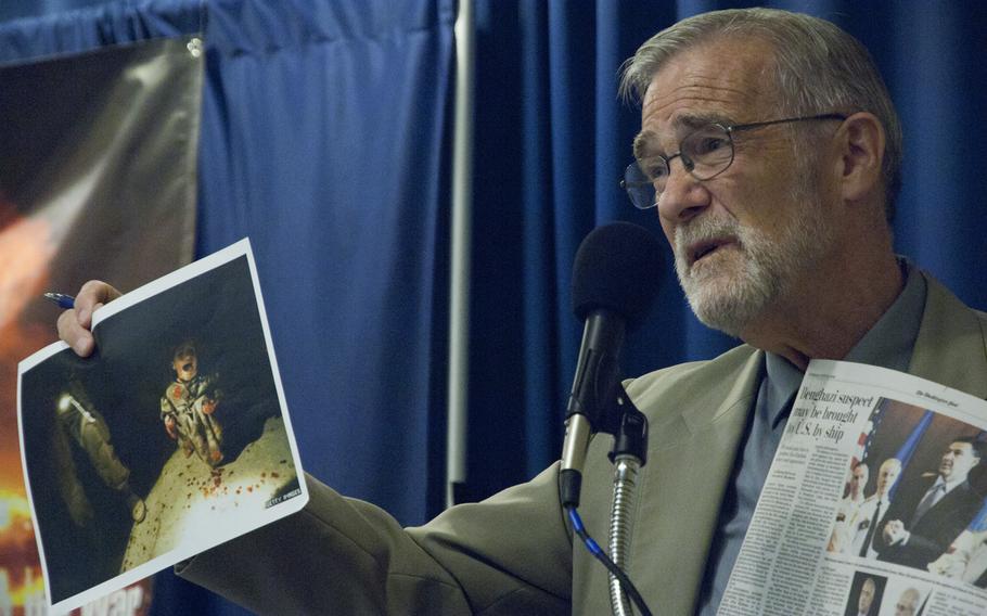 Ray McGovern, an Army veteran and former CIA intelligence analyst, holds up a photo of an Iraqi girl, 6, whose family he said was shot by U.S. troops, as he speaks in Washington warning against sending more troops to Iraq on June 19, 2014. McGovern, who served in the 1960s, is the co-founder of Veteran Intelligence Professionals for Sanity.