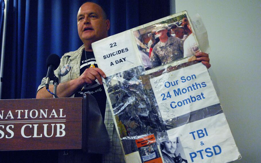 Tim Kahlor, a father of an Army veteran who served two tours in Iraq and was diagnosed with PTSD, warns against sending more US troops to Iraq on June 19, 2014 in Washington, D.C. 