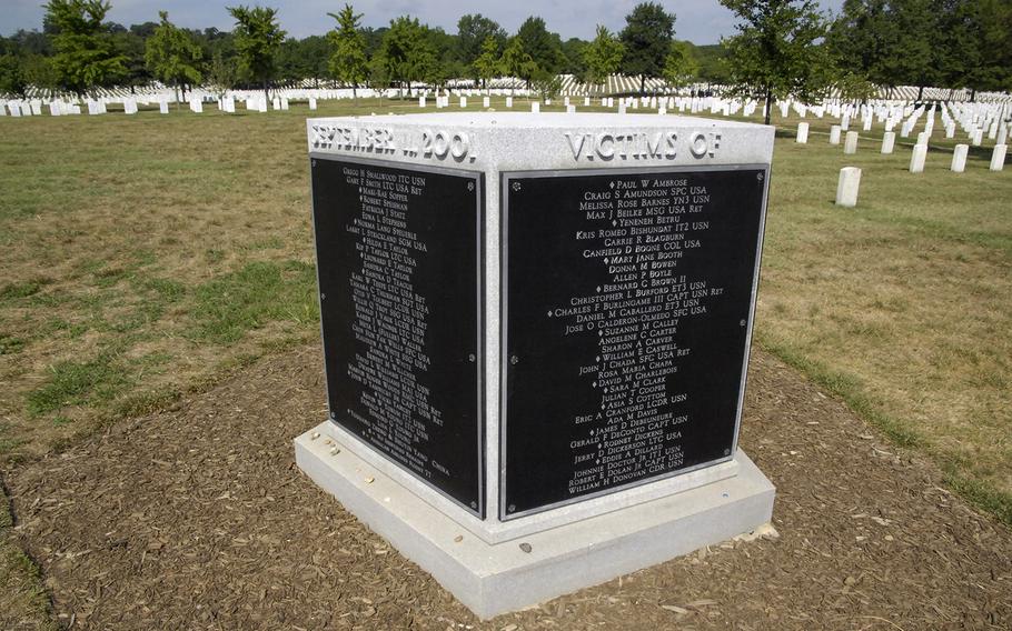 The Pentagon Group Burial Marker, a memorial for those who died in the Pentagon or on American Airlines Flight 77 in the Sept. 11 attacks, stands near section 64 of Arlington National Cemetery.
