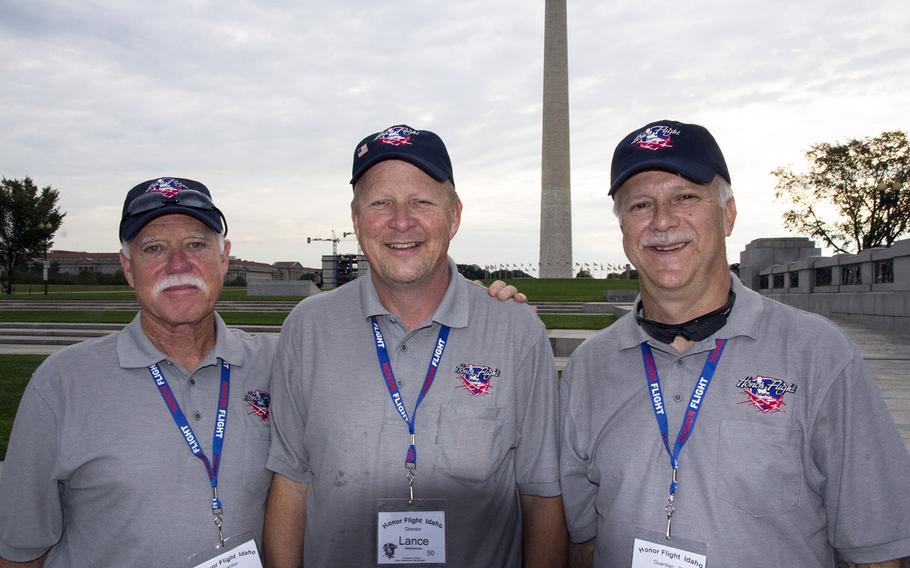 Honor Flight of Idaho director Lance Stephensen is flanked by Mike Stallcup, left, and medical coordinator Ron Andersen at the National World War II Memorial in Washington, D.C., September 3, 2014.